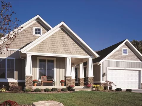 House with tan board and batten siding